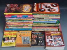 Fifty-five TV related annuals and books including Man From UNCLE, Magic Roundabout, Mission