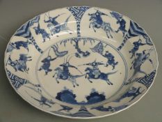 Chinese 18thC, probably Kuang Hsu, large dish decorated with battle scenes and chrysanthemum