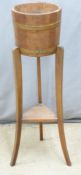 Coopered oak jardiniere stand, H91cm