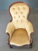 Victorian button back nursing chair with bulbous reeded legs, raised on castors