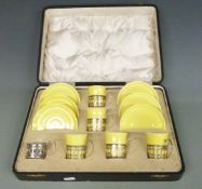 Shelley cased coffee set with hallmarked silver holders, one cup missing