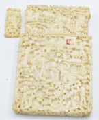 A 19thC Chinese carved ivory card case depicting figures and a village scene, 10 x 6.8cm