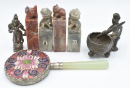 A Chinese cloisonné mirror, two pairs of Chinese soapstone seals, and a tribal bronze