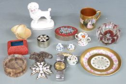 A heavily gilded portrait cabinet cup and saucer with 'Gainsborough' to base, Derby style poodle,