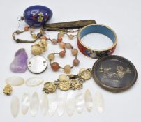Twelve Chinese mother of pearl counters, amethyst carved pendant, Japanese compact, cinnabar lacquer