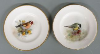 Two Royal Worcester pin dishes hand decorated with Great Tit and Goldfinch, both signed Powell,