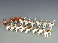 A large collection of Beswick hounds and foxes, H7cm