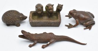 Four Japanese bronzes, a crocodile, frog, hedgehog, and pigs at a trough, three marked to base,