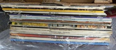 Approximately 30 albums including The Beatles and The Rolling Stones (later issues)
