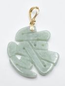 A 14k gold and jadeite pendant, 3cm