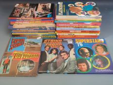 Thirty-one TV related annuals including Captain Scarlet, Supercar, The Persuaders, Burkes Law,