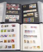 Four stockbooks QEII stamps, mainly used