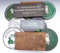 A collection of Gloucestershire Wildlife Trust cast metal, wooden and copper or similar signs and
