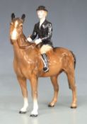 Beswick huntswoman on a brown horse, H22cm