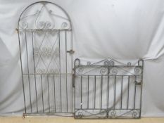 Two wrought iron gates. W113 x H103cm and W82 x H185cm