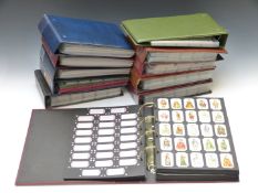 Eleven albums of reproduction cigarette cards including cars, cricket etc