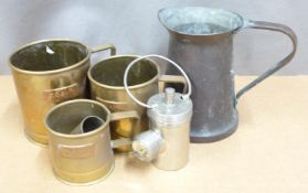 Arts and Crafts style copper jug with riveted handle, graduated set of three brass grain measures,