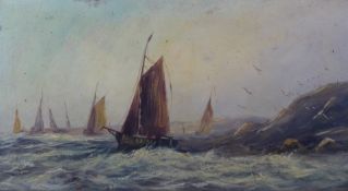 Oil on board, fishing boats in a stormy sea off a rocky headland, 29 x 54cm