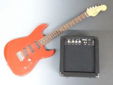 Encore electric lead/rhythm guitar in cherry red lacquered finish together with an 