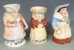 Three 19thC female Toby jugs, tallest 25cm