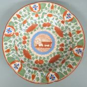 An unusual 18thC creamware dish, all over decorated with foliage, the centre cartouche with stylised