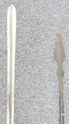 A collection of 19th/20thC African weaponry including axe, bow, arrows and spears, probably