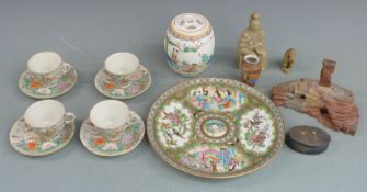 A collection of Chinese and Japanese ceramics including a famille rose dish (25cm in diameter), cups