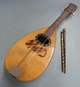 Joseph Wallace, London, brass flute, together with a 19thC round back mandolin and a tin whistle
