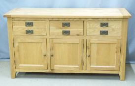 Contemporary light oak sideboard with three drawers and three cupboards, W160 x D57 x H90cm