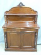 Victorian mahogany credenza with bobbin turned decoration, serpentine front and leaf finial, W107