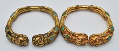 Two Chinese gilt bangles depicting dragons