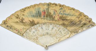 A 19thC ivory fan with carved figural guard sticks and decorated with three painted figures