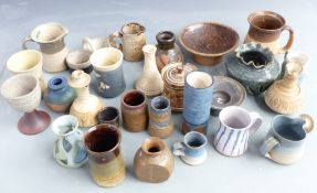 A large collection of studio pottery including Troika vase, Glynhir, some signed pieces, tallest