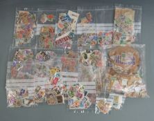 Loose UK, Commonwealth and Foreign stamps in plastic bags