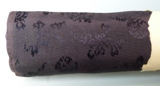 A roll of Chinese silk in original paper packaging together with three Chinese embroidered panels,