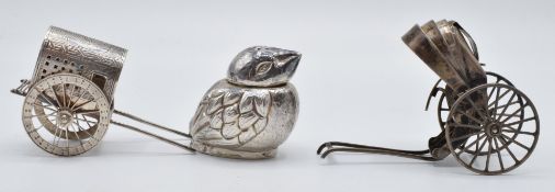 Chinese silver pepper in the form of a chick with character marks to base, L5cm, and two silver