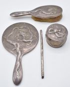 Wang Hing Chinese silver dressing table set with dragon decoration, comprising hand mirror, brush,