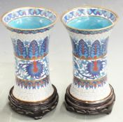 A pair of Chinese cloisonné vases on hardwood stands, H18cm