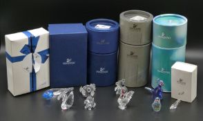 Nine Swarovski crystal glass animals and ornaments including Lovlots penguin and dinosaur, fish,