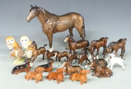 A collection of Beswick foals, dogs and birds