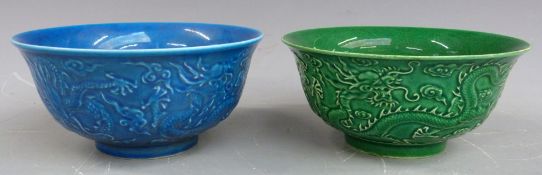 Two Chinese crackle glaze bowls with dragon decoration, one green and one blue, both with mark to