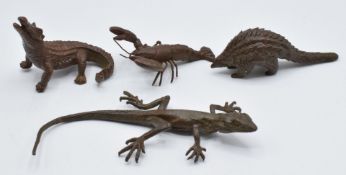 Four Japanese bronzes, a lizard, lobster, crocodile and pangolin, three marked to base, largest 10 x