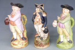 Three 19th/20thC standing Toby jugs including Nelson, tallest 28cm