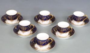 Six Cauldon gilded coffee cans and saucers