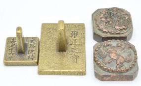 Two brass seals, and two other seals