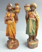 A pair of terracotta blackamoor water carrier figures possibly Goldscheider, with impressed