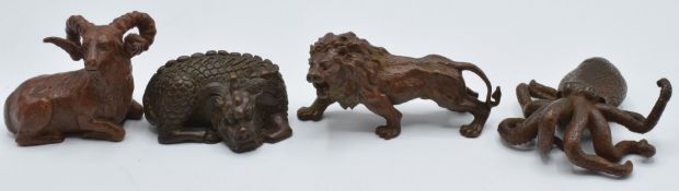 Four Japanese bronzes, a lion, octopus, dragon, and ram, all marked to base, largest 5.5 x 4.5cm