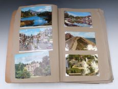Album of postcards to include Devon, Swanage, Cornwall, Lake Orta, Lake District and Ireland
