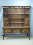 Georgian style oak dresser with crossbanded decoration, breakfront top and dentil cornice raised