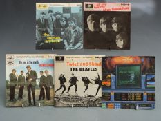 Approximately 50 singles and E.Ps from the 1960s, in a case